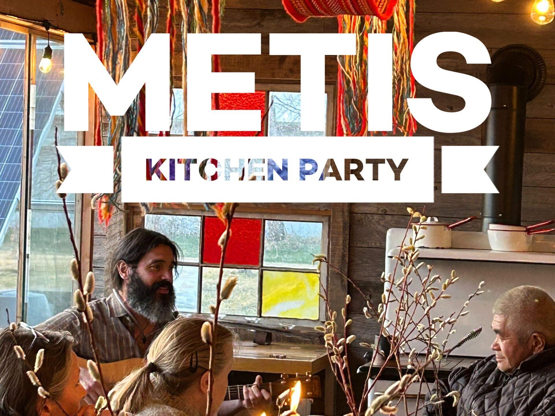 Métis Kitchen Party Banner with sash and lights hanging in the background.