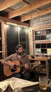 Justin Lacroix playing the guitar.